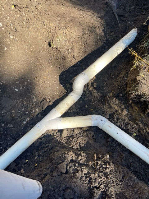 downspout extensions going to a main line